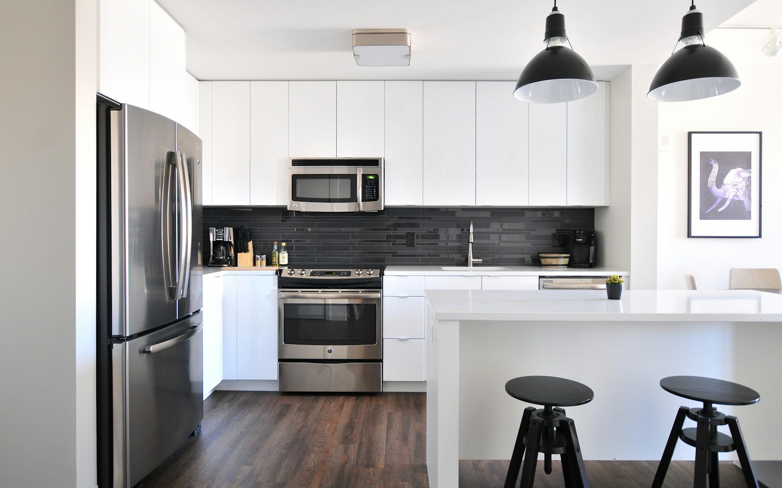 A bright organized kitchen with practical work surfaces